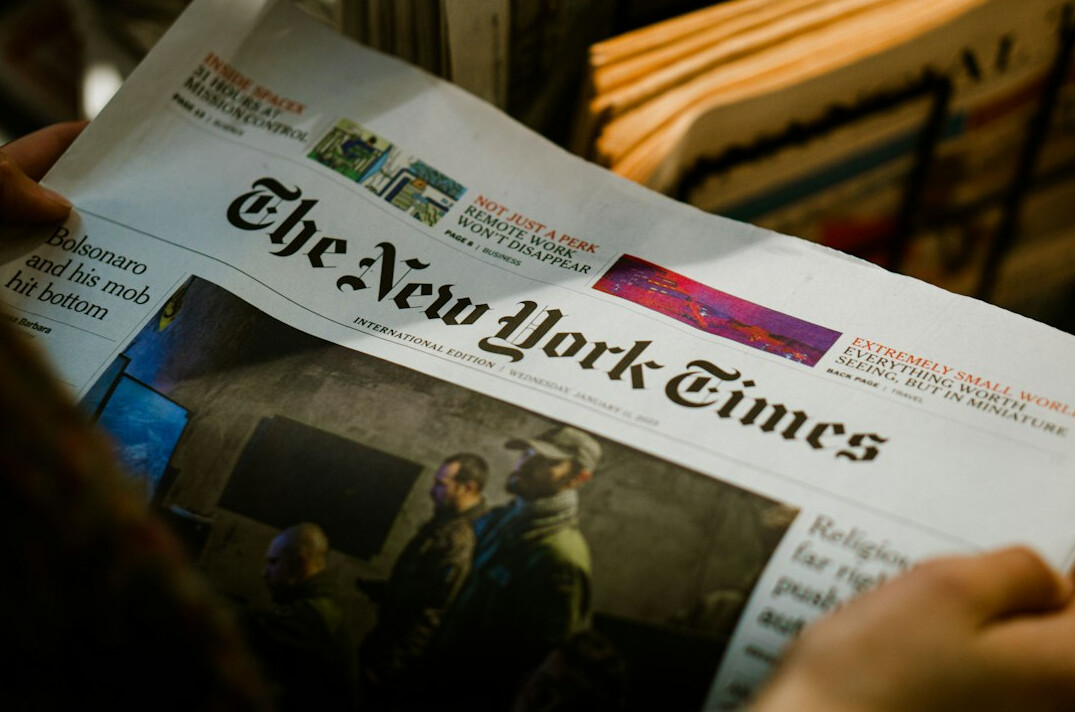 person reading newspaper